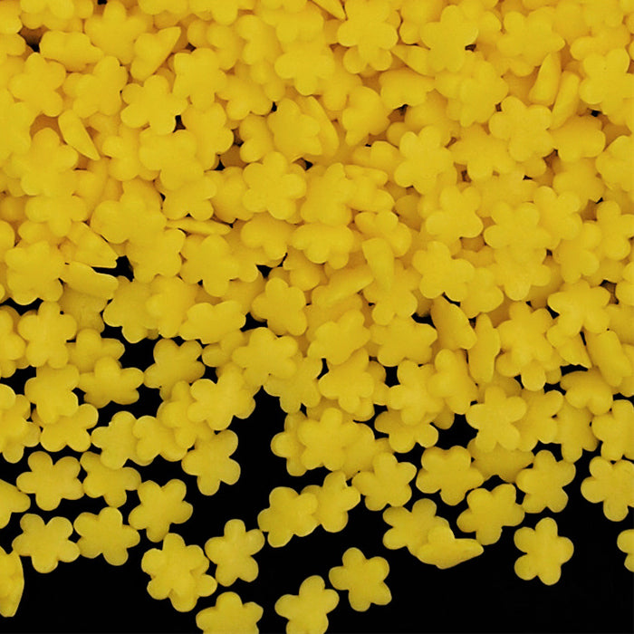 Pile of colorful flower sprinkles for cupcakes and ice-cream. Top